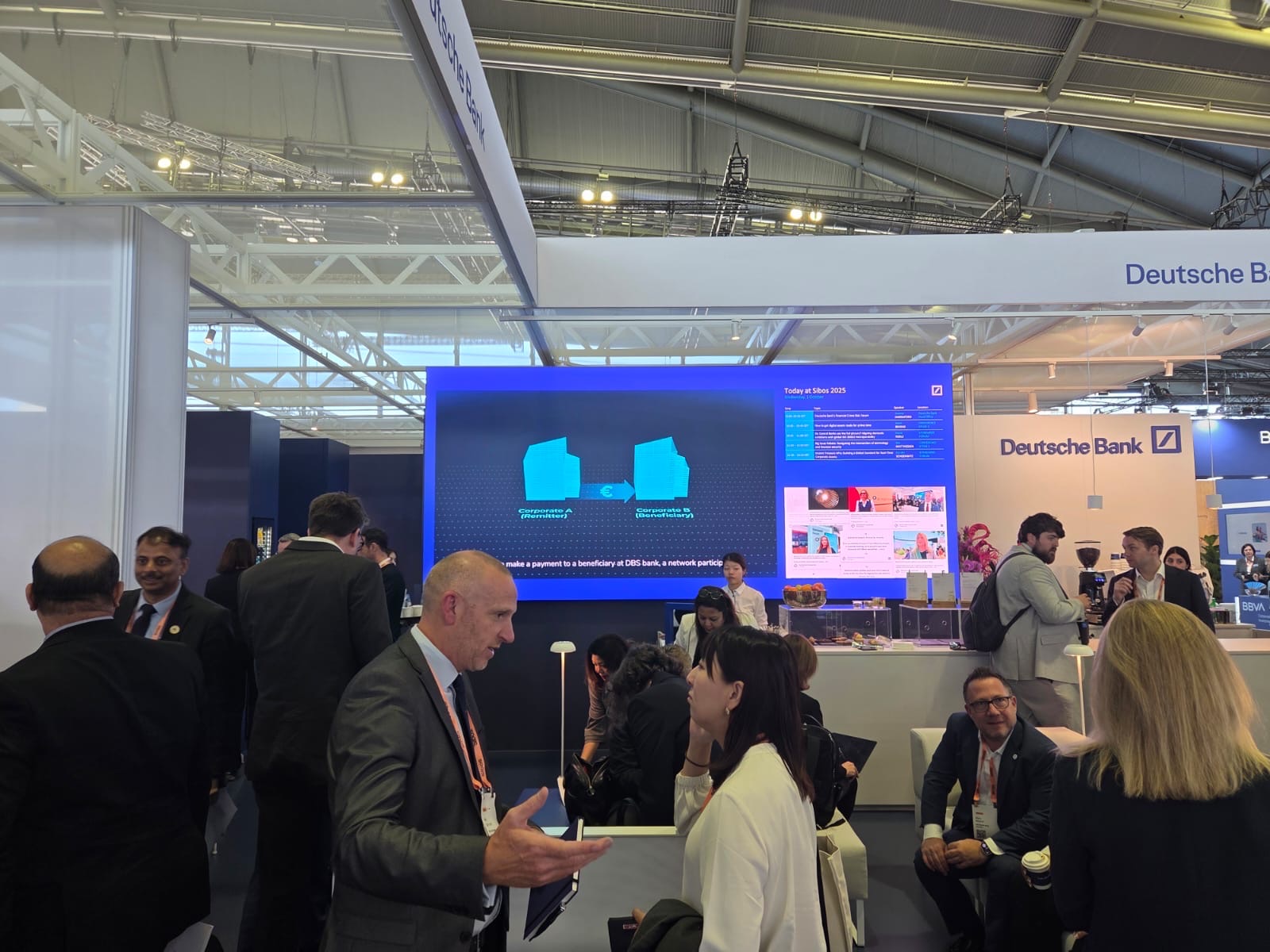 Deutsche Bank's stand at Sibos 2025 with the Partior platform video playing on the main screen